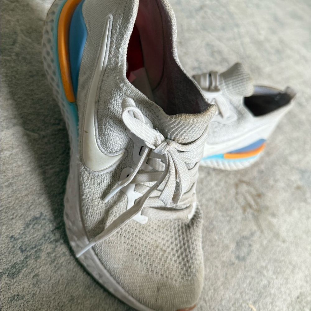 Nike Gray Sneakers with Blue and Orange Accents